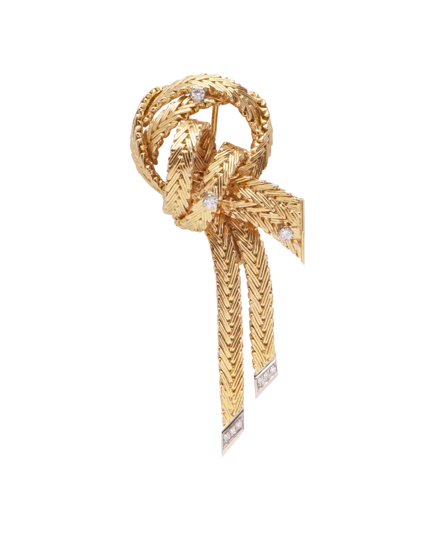 Broche en Noeud avec 2 Ors jaune et blanc. Disponible chez VIRTU LUXURY.